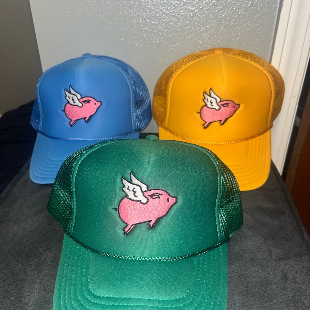 “PIGS FLY EAST” Trucker Hats - Blue, Yellow, Green